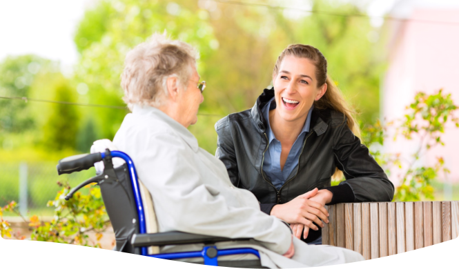 patient and caregiver smiling