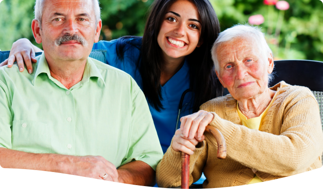 elderly couple and caregiver smiling